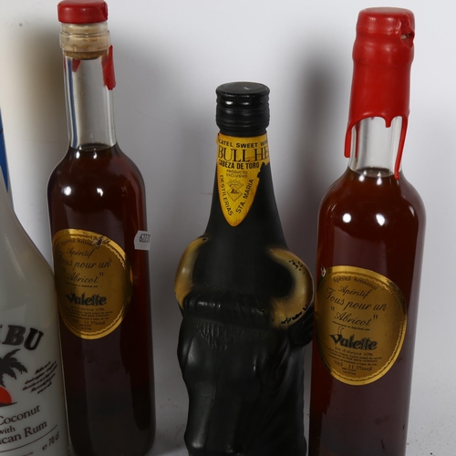 298 - A 70cl bottle of Malibu, in original display packaging, 2 bottles of French apricot aperitif, and a ... 