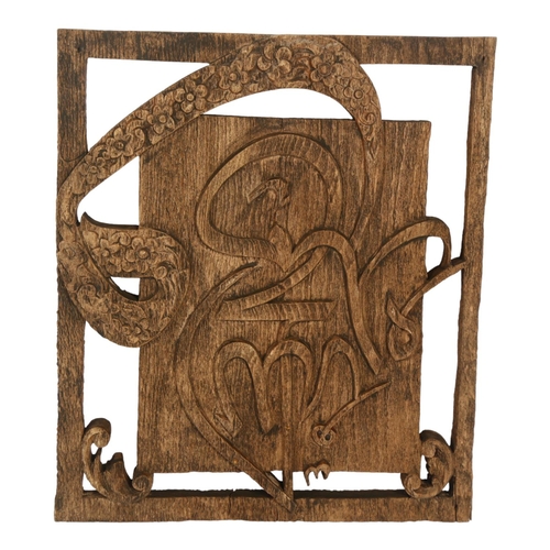 306 - A carved wood panel, H23cm