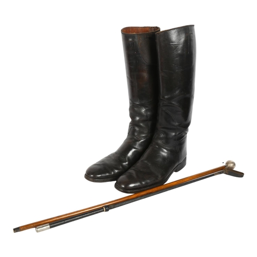 307 - A 1946 silver topped Devonshire Regiment swagger stick, a pair of military leather boots and a horse... 