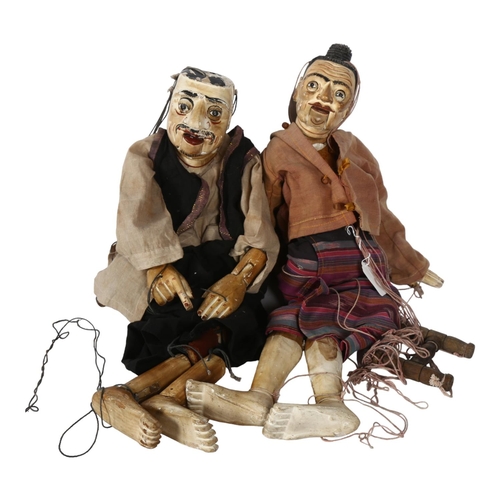 315 - A pair of Vintage South East Asian carved and painted wood marionette puppets, H64cm approx