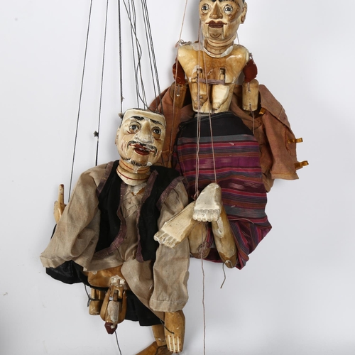 315 - A pair of Vintage South East Asian carved and painted wood marionette puppets, H64cm approx