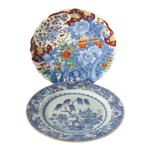 319 - An 18th century Chinese blue and white plate with hand painted decoration, diameter 32cm (restored),... 