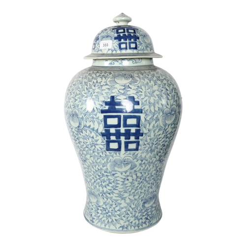 333 - A large Chinese blue and white jar and cover, with allover floral and foliate design, 59cm