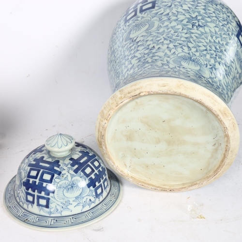 333 - A large Chinese blue and white jar and cover, with allover floral and foliate design, 59cm