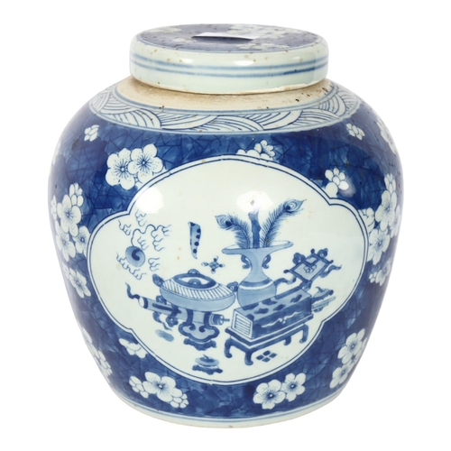 334 - A Chinese blue and white ginger jar and cover, with panels of interior designs on prunus ground, H22... 