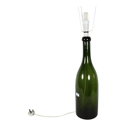 341 - A large Antique green glass bottle converted to an electric lamp, height to top of bottle 58cm