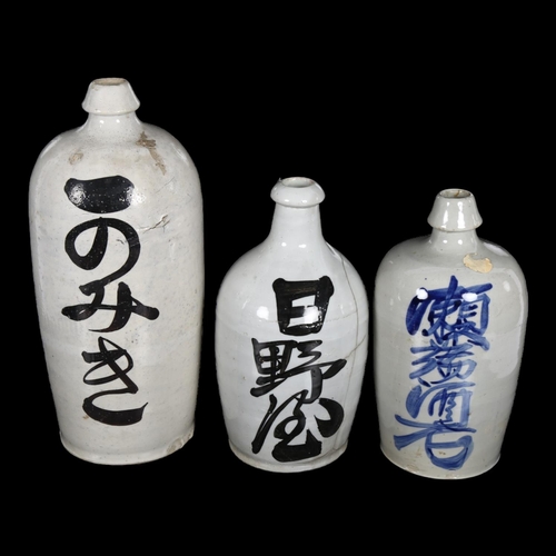 348 - 3 Japanese stoneware flagons with script, tallest 34cm