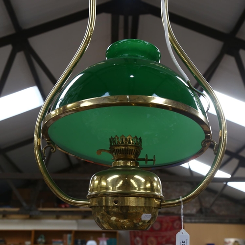 372 - A brass oil lamp design ceiling light fitting, with green glass shade, 42cm across