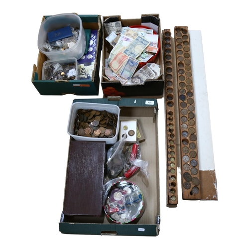 374 - A large quantity of British pre-decimal currency, commemorative coins, and 2 handmade pine storage d... 