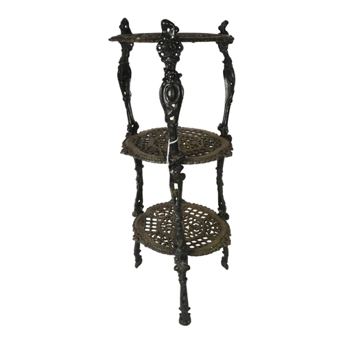 389 - A cast-iron 3-tier stand with pierced decoration, 66.5cm