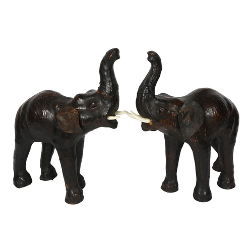 390 - A pair of carved and painted trumpeting elephants with leather ears, H35cm