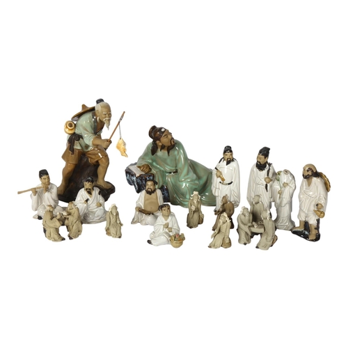 391 - A group of various ceramic Oriental figures, tallest angler 19.5cm