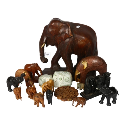 394 - A carved hardwood elephant, 37cm, smaller elephants, and 3 wise monkeys