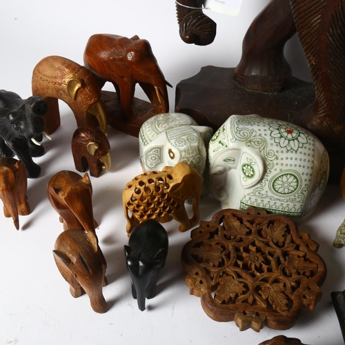 394 - A carved hardwood elephant, 37cm, smaller elephants, and 3 wise monkeys