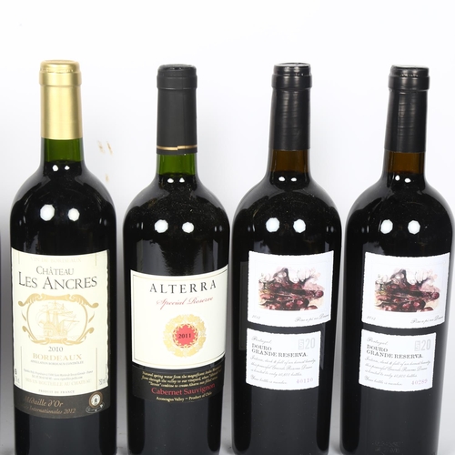 408 - 5 bottles of Portuguese Douro Grande Reserva, and a bottle of Bordeaux 2010