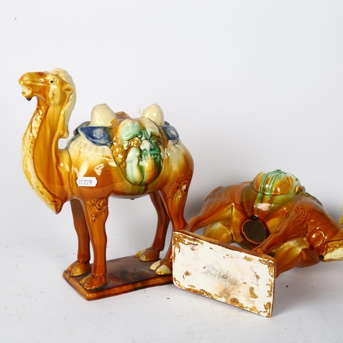 432 - A pair of Oriental painted pottery camels, H30.5cm