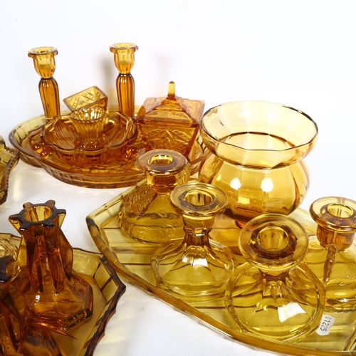 455 - 4 x 1930s amber glass dressing table trays, and matching dressing table items, including jars and co... 