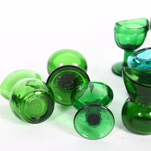 459 - A collection of Vintage green glass eye baths