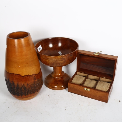 493 - A turned yew wood comport, H21cm, a hardwood jewel box, and a turned and carved wood vase