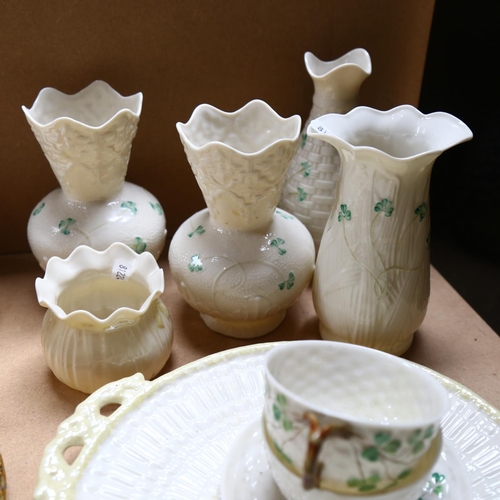 497 - A group of Belleek china, including vases, cups and saucers, preserve pot etc, various back stamps, ... 