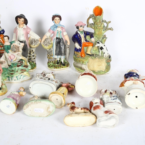 504 - A group of Victorian Staffordshire figures, tallest spill vase 22cm, a Toby desk sander, egg stand e... 