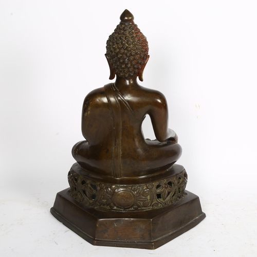 514 - A bronze seated Buddha on pierced foliate plinth, H41cm