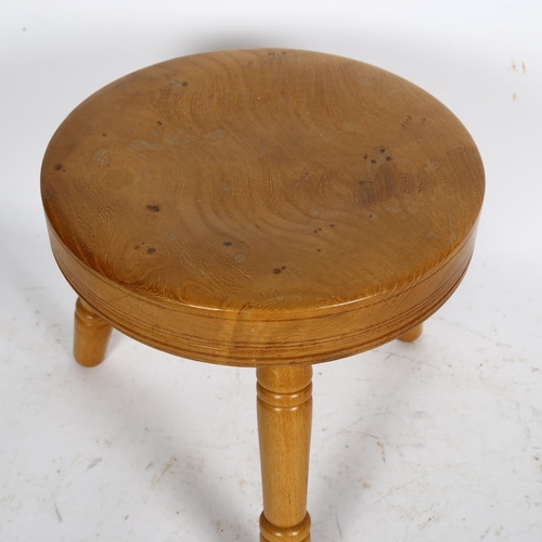 525 - An oak and elm 3-legged stool, H24cm