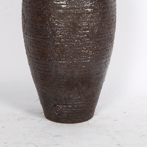 528 - Adrian Davies studio pottery, a tall textured vase, with makers mark, height  38cm