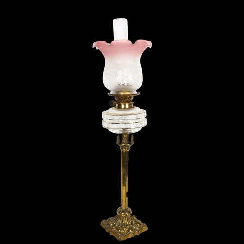 533 - A Victorian embossed brass oil lamp, with glass font, chimney and etched glass shade, H74cm