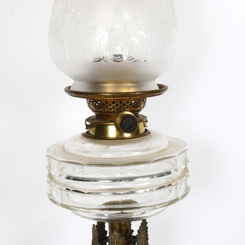 533 - A Victorian embossed brass oil lamp, with glass font, chimney and etched glass shade, H74cm