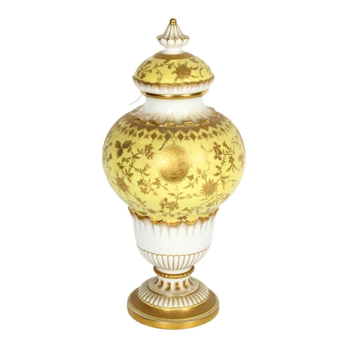 555 - Antique Minton's porcelain vase and cover, with gilded decoration on yellow ground, H28cm