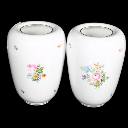 560 - A pair of Herend porcelain vases, with painted floral sprays, H20cm