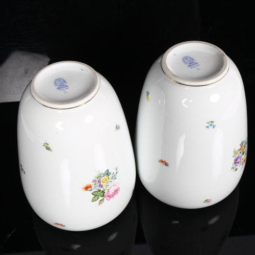 560 - A pair of Herend porcelain vases, with painted floral sprays, H20cm