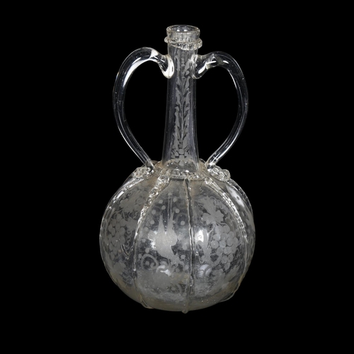 563 - 18th century 2-handled glass decanter with etched grapevine decorated panels, H23cm