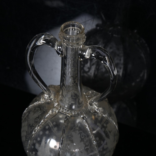 563 - 18th century 2-handled glass decanter with etched grapevine decorated panels, H23cm