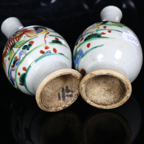 566 - A pair of Chinese vases, with design of cockerels, H14.5cm