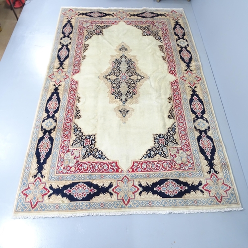 2286 - A cream-ground Kirman carpet. 285x180cm.