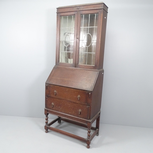 2153 - An early 20th century two section bureau bookcase by Jas Shoolbred & Co Ltd of London, the top secti... 