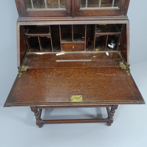 2153 - An early 20th century two section bureau bookcase by Jas Shoolbred & Co Ltd of London, the top secti... 