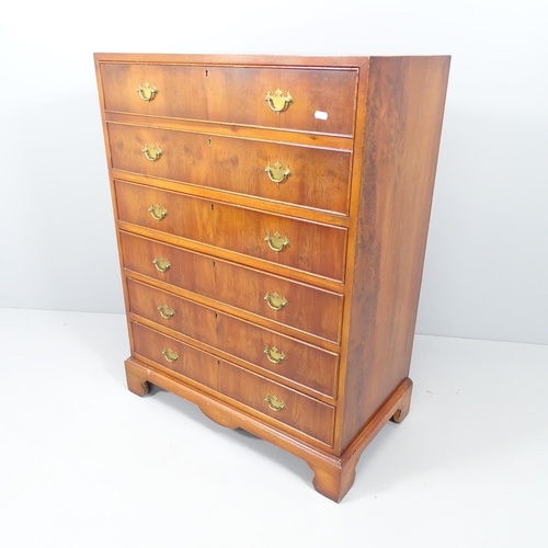 2155 - A reproduction mahogany secretaire chest, the secretaire with fitted interior and three long drawers... 