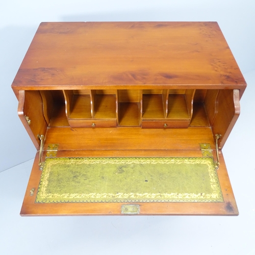 2155 - A reproduction mahogany secretaire chest, the secretaire with fitted interior and three long drawers... 