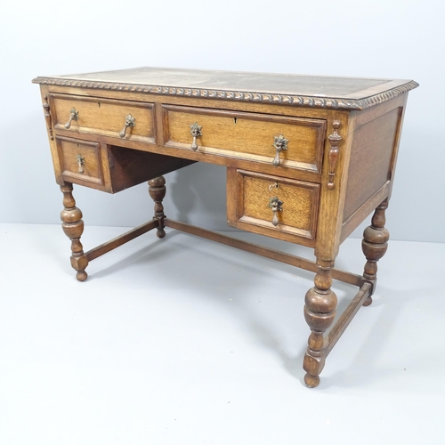 2157 - An early 20th century Jacobean style kneehole writing desk, with four frieze drawers. Overall 108x78... 