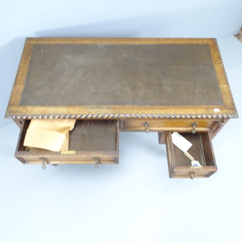 2157 - An early 20th century Jacobean style kneehole writing desk, with four frieze drawers. Overall 108x78... 