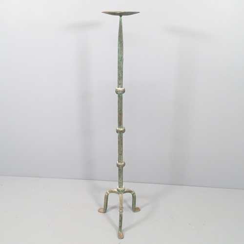 2161 - A cast iron floor standing candle stand. Height 125cm.