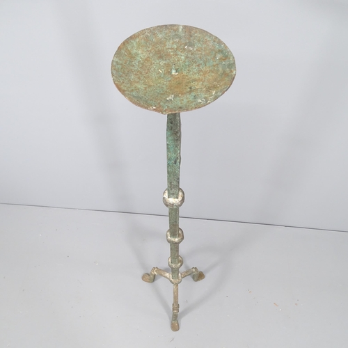 2161 - A cast iron floor standing candle stand. Height 125cm.