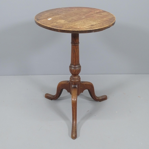 2166 - An antique oak circular topped occasional table on tripod base. 48x72cm.