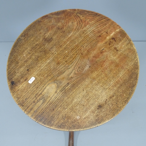 2166 - An antique oak circular topped occasional table on tripod base. 48x72cm.