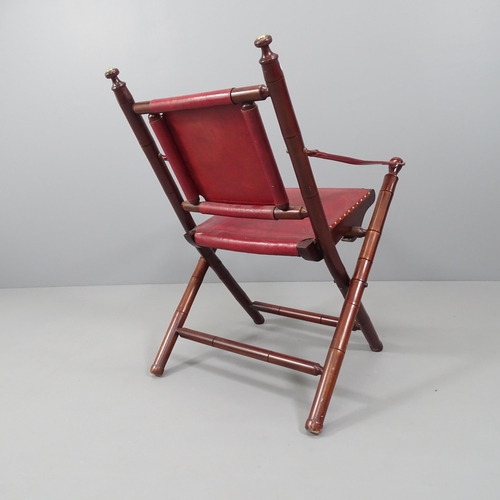 2176 - A mahogany and leather upholstered folding chair.