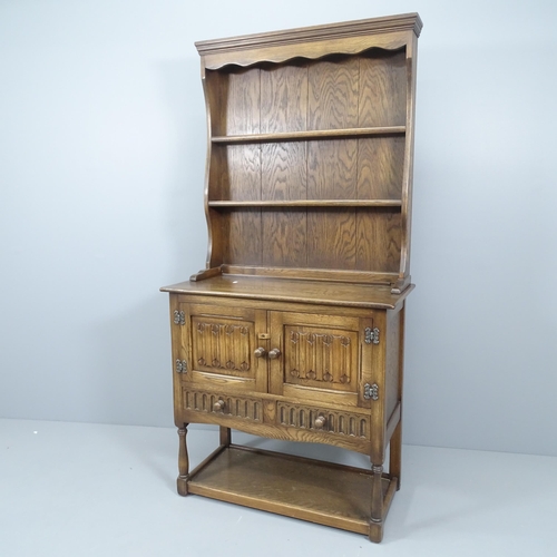 2188 - A mid-century oak two-section dresser, with linenfold carved decoration.. 84x170x41cm