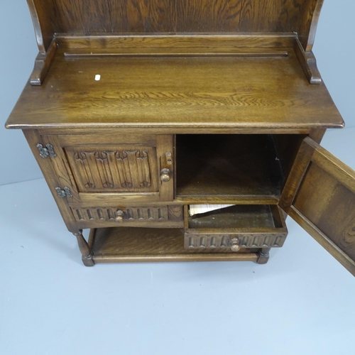 2188 - A mid-century oak two-section dresser, with linenfold carved decoration.. 84x170x41cm